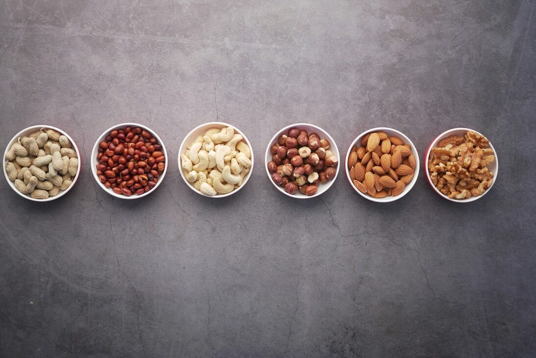 Image with bowls of nuts and legumes